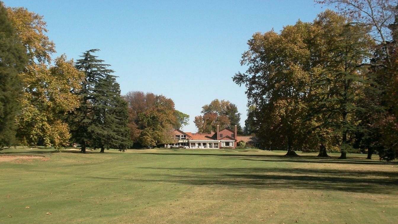 Fairway lined with mature trees